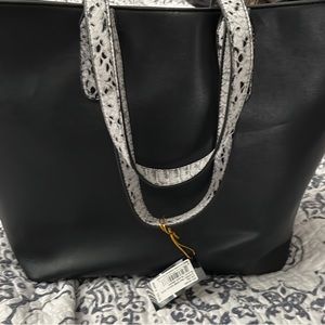 Large black Bebe purse never used